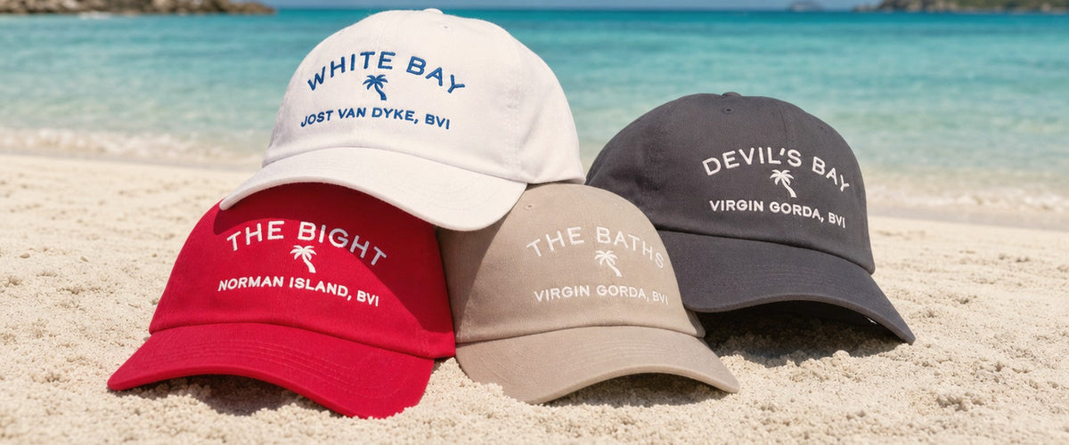 Four Bareboat Yacht Club anchorage dad caps on a Caribbean beach